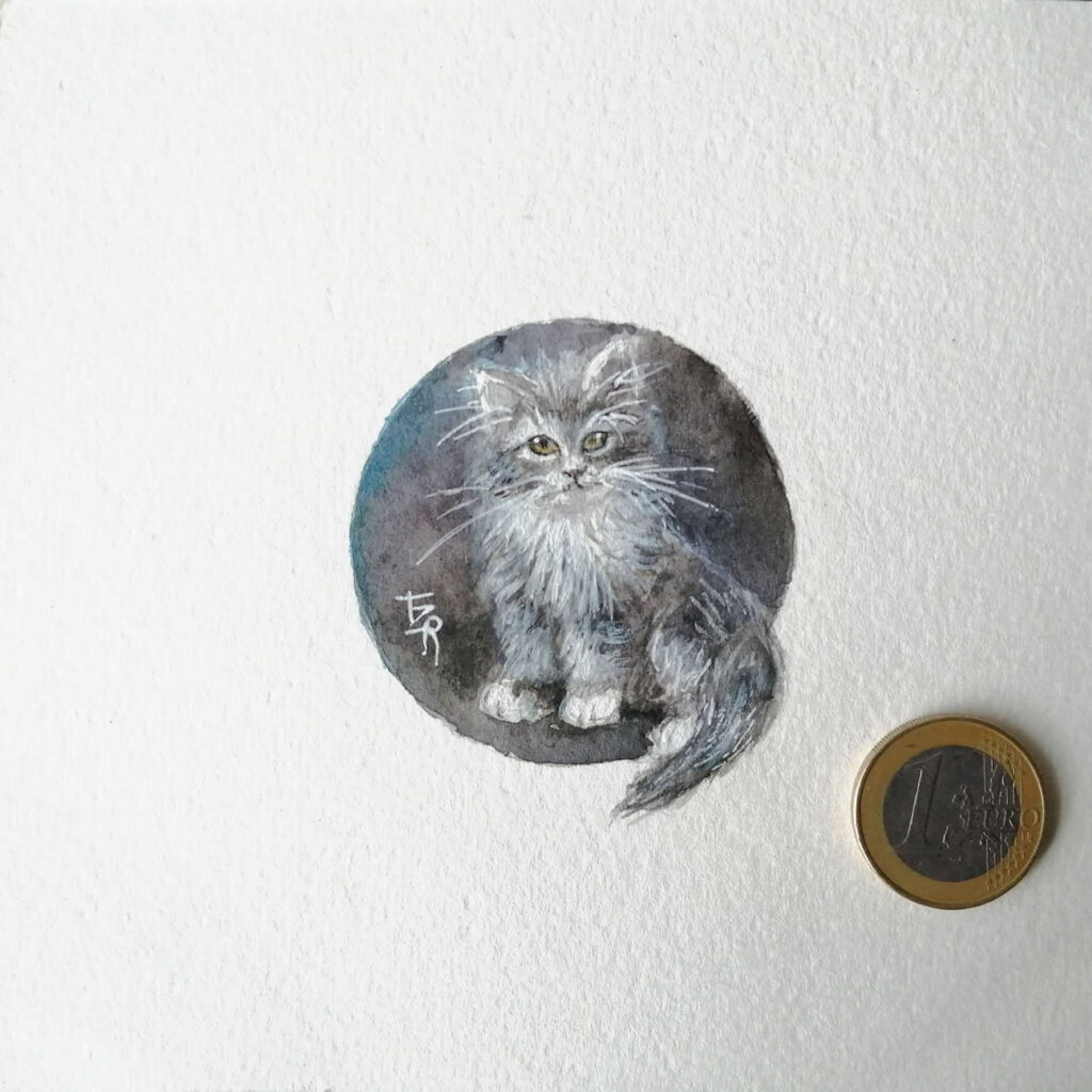 Chaton angora miniature sur papier